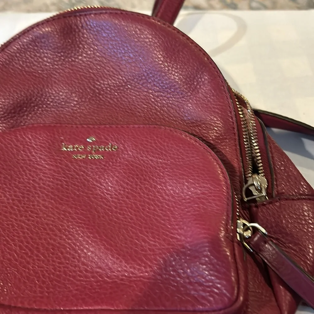 Kate, spade wine colored back pack in pebbled grain leather Beautiful lining